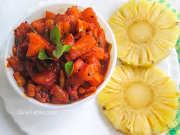 Pineapple Aachar served in a glass jar with spices